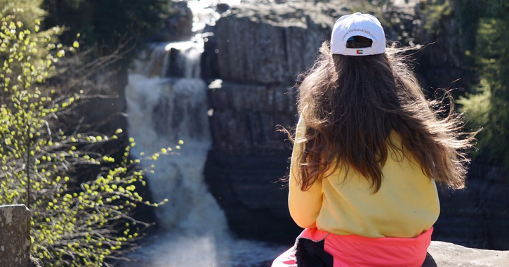 Child enjoying the view of High Force in County Durham. 